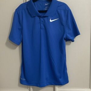Nike Blue Polo dri-fit boys size 7 , with White Swoosh , collared
